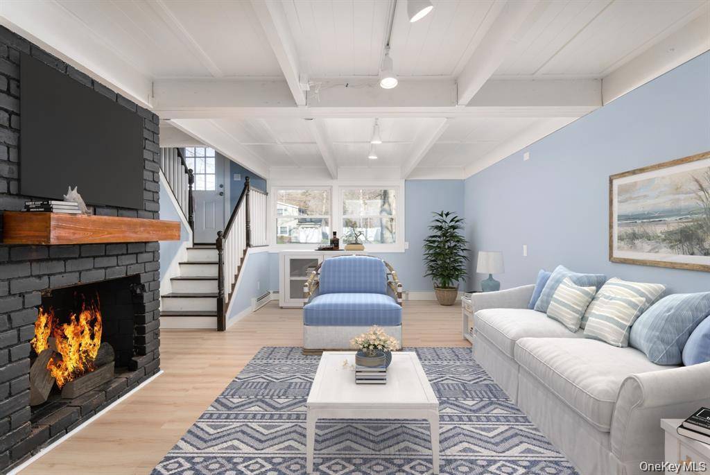 Welcome Home to this beautifully renovated Hi Ranch nestled in the heart of Stony Brook.