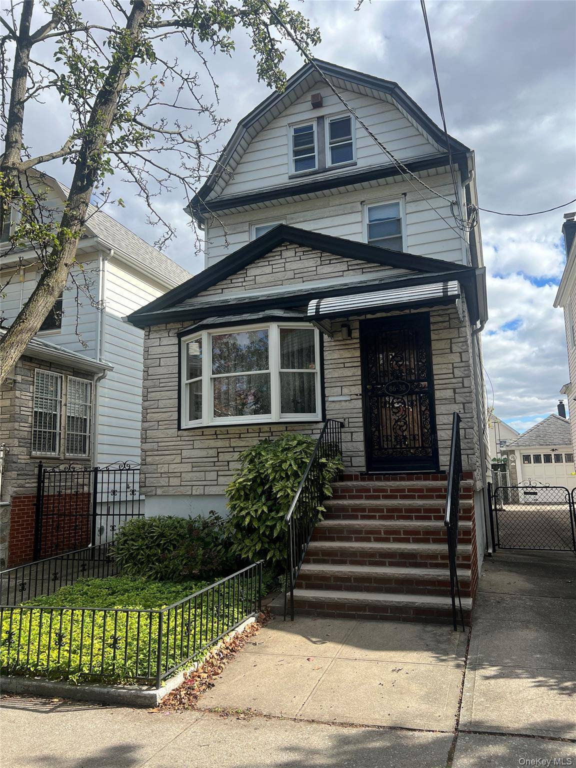 1 Dwelling Home Located in the Heart of Elmhurst.
