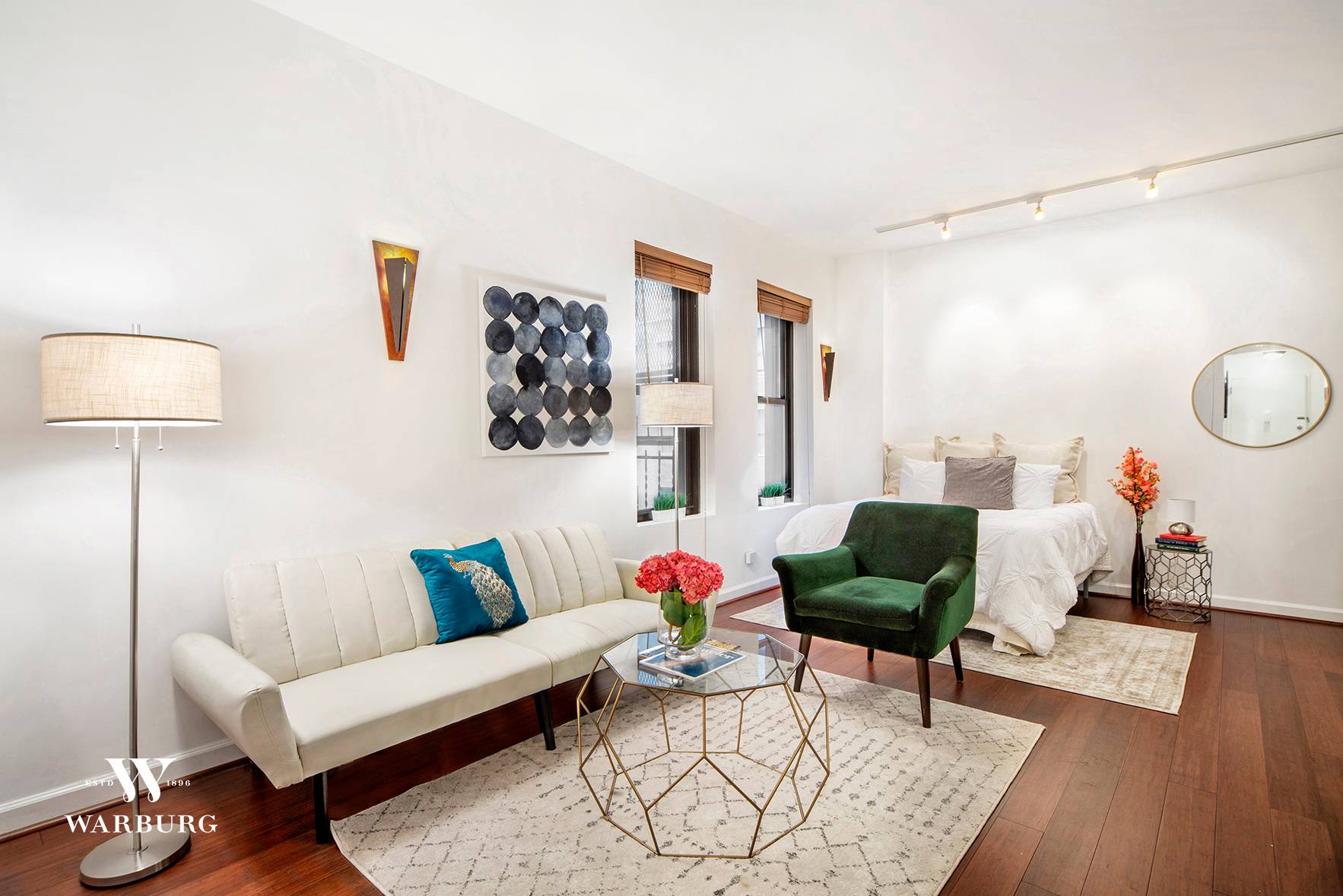 Apartment 10C is a wonderfully spacious, loft like studio, with soaring 10 foot ceilings, and beautiful, over sized windows.