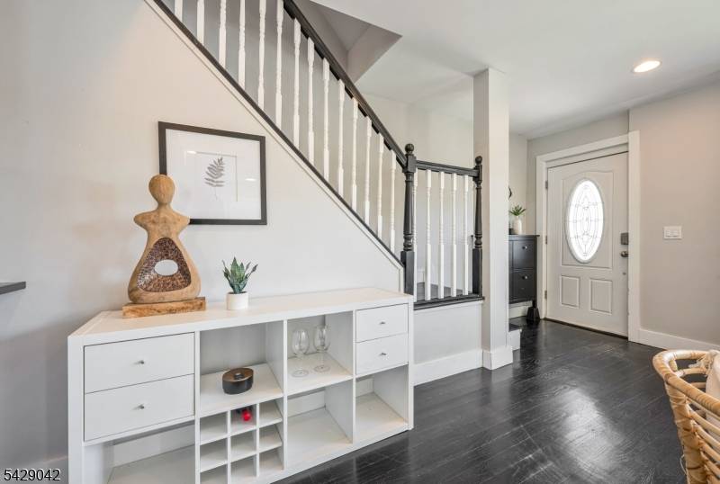 Welcome to this renovated side hall colonial, ideally situated on a quiet street in the heart of Teaneck.