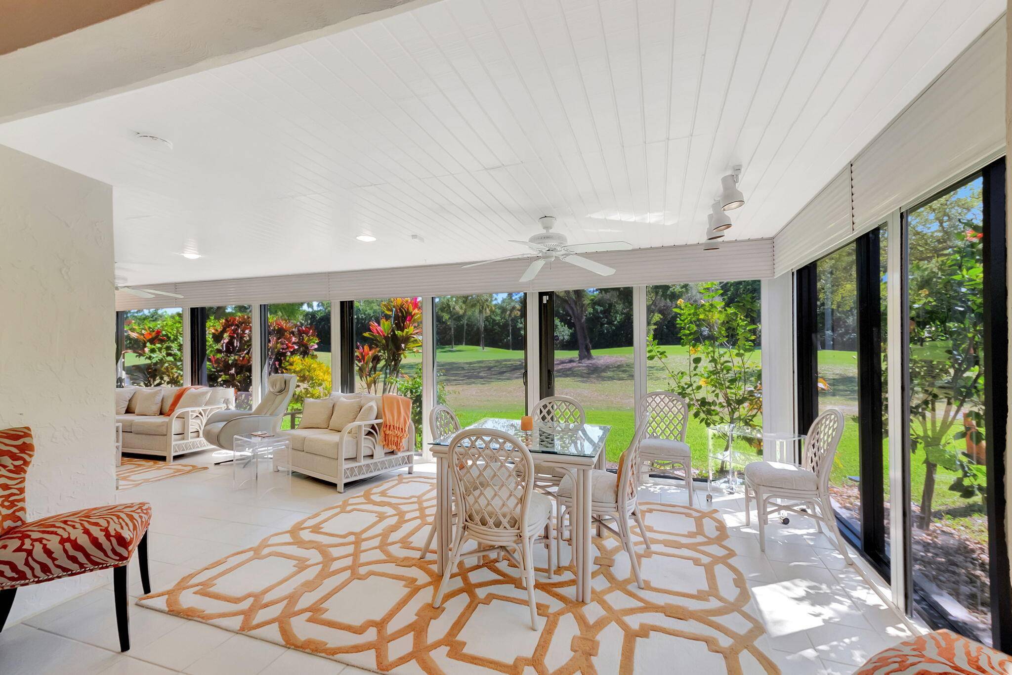 Welcome Home ! This stunning, light filled villa with a spacious den and an expansive Florida room is perfectly situated on the golf course in Boca Lago.