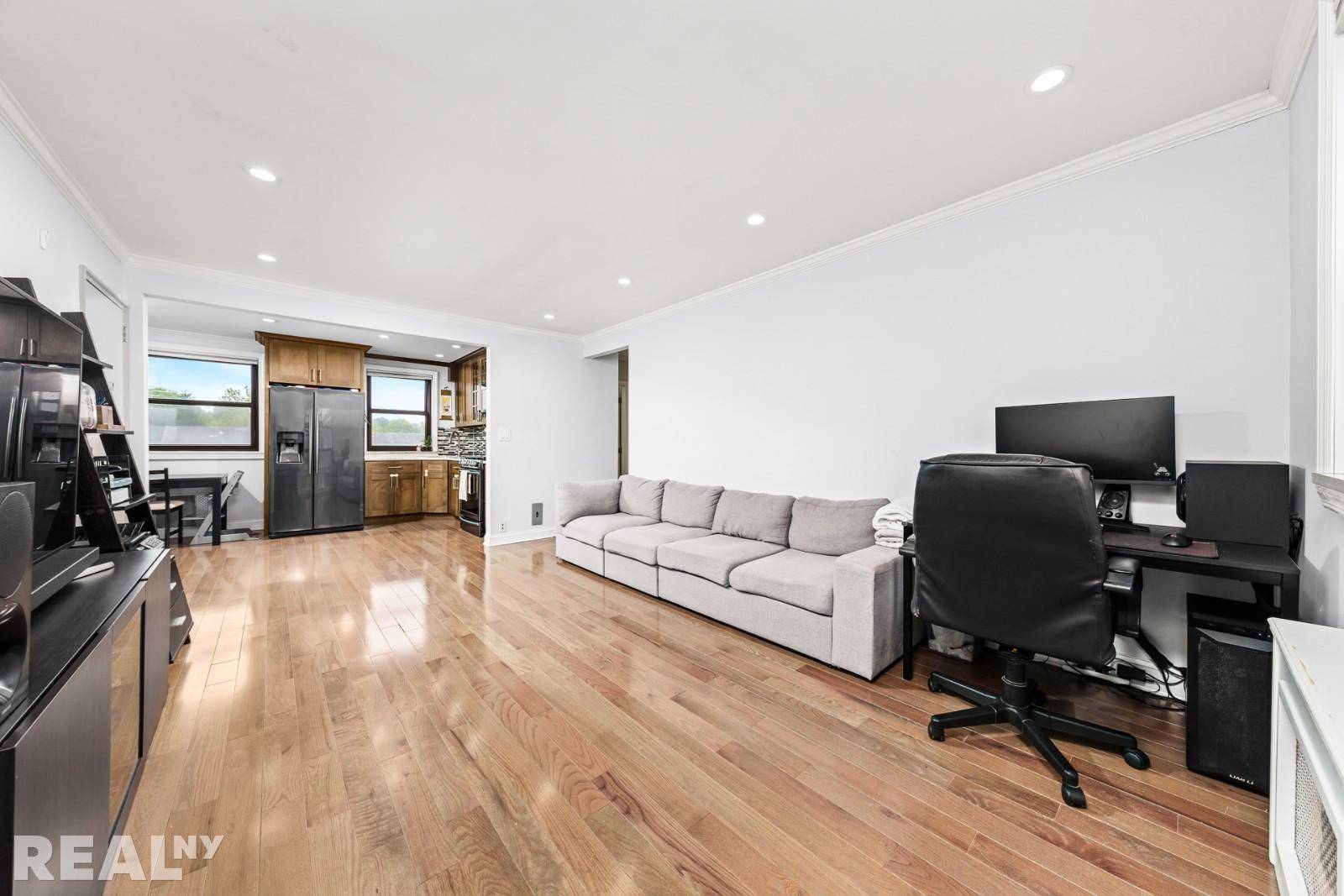 Welcome to this fully gut renovated upper floor 2 bedroom, 1 bathroom co op apartment, ideally nestled in a charming garden front courtyard building.