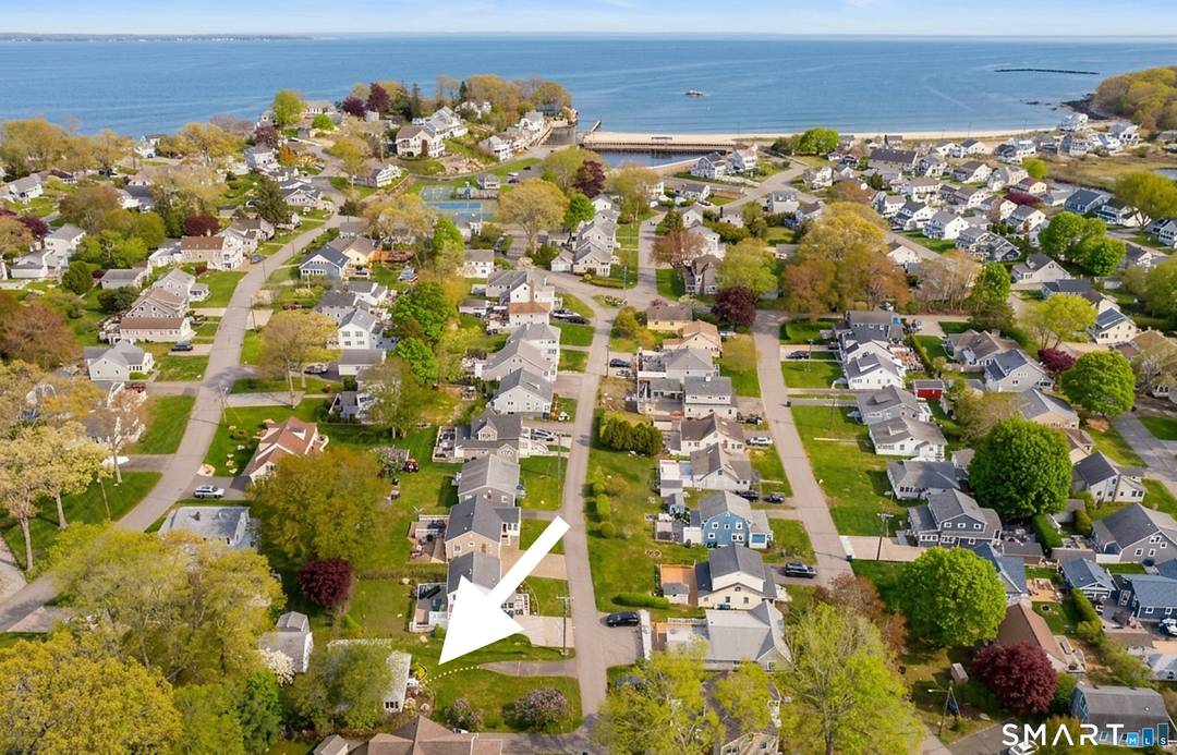Located in Point O' Woods beach community, 18 Hough Road is the quintessential shoreline cottage, just a short stroll or golf cart ride to the community's beautiful private sandy beach.