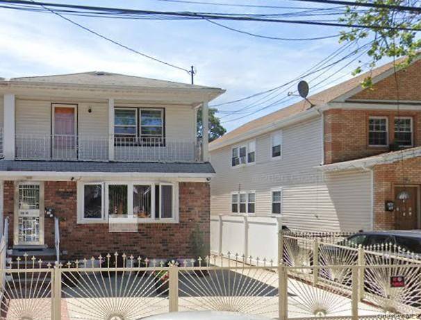 Semi attached legal two family home in the heart of Queens with a private driveway.
