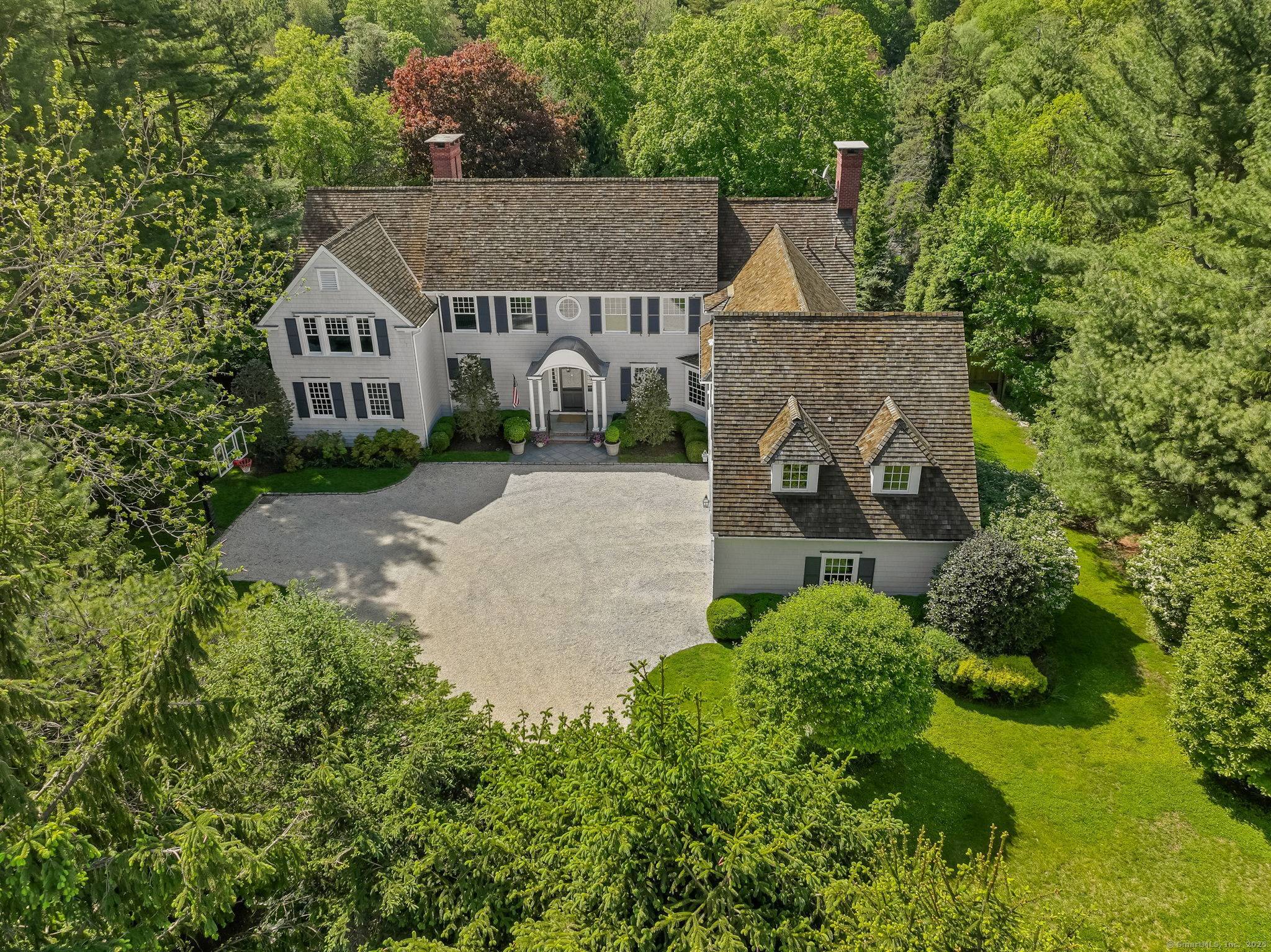 Nestled within a picturesque enclave of distinguished luxury homes in Westport's coveted Greens Farms neighborhood, you'll know you've arrived as mature, stately hedges guide you down a flowering, tree lined ...