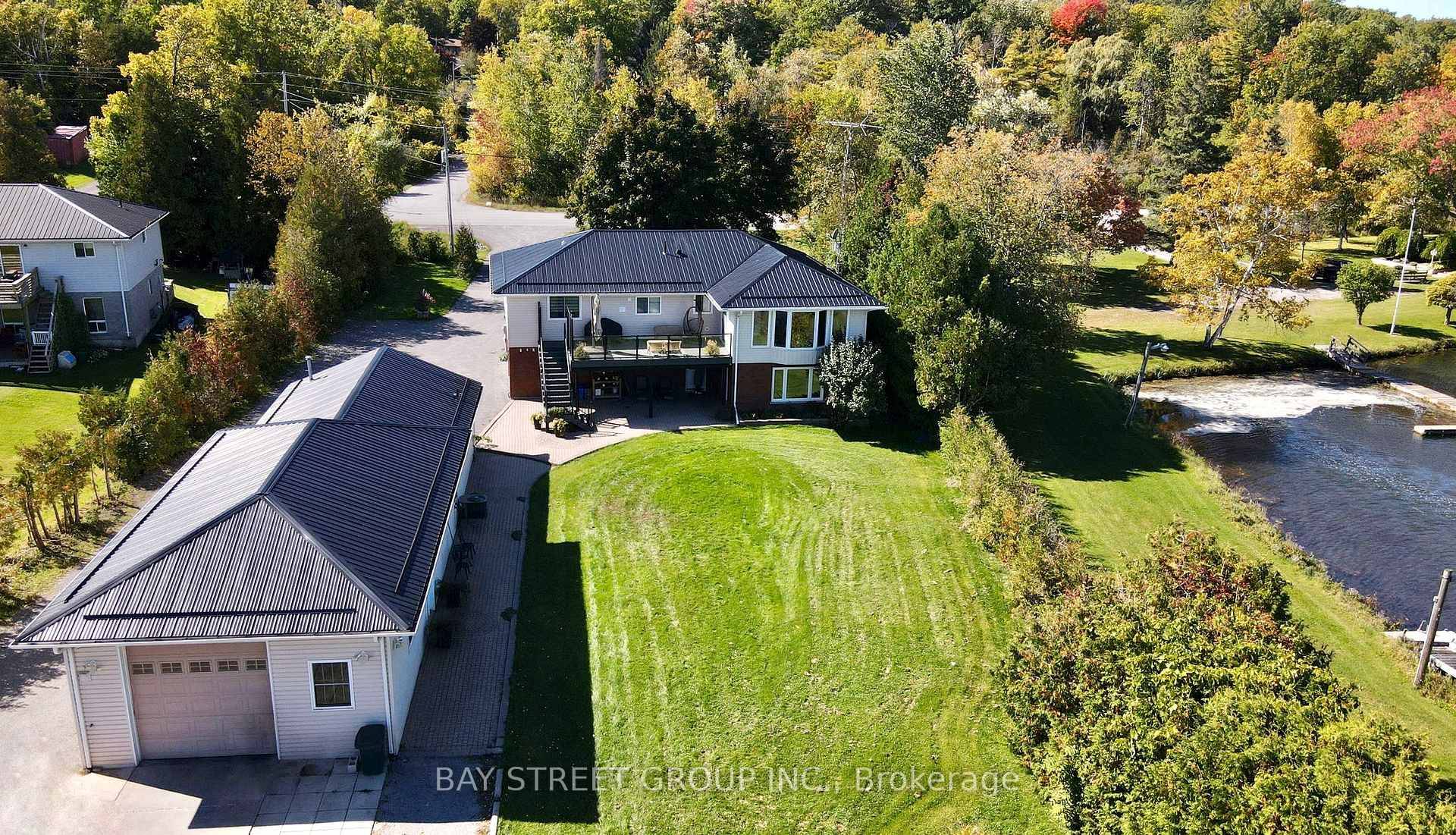 Luxurious Lakefront Living on Rice Lake Raised Bungalow on 1.