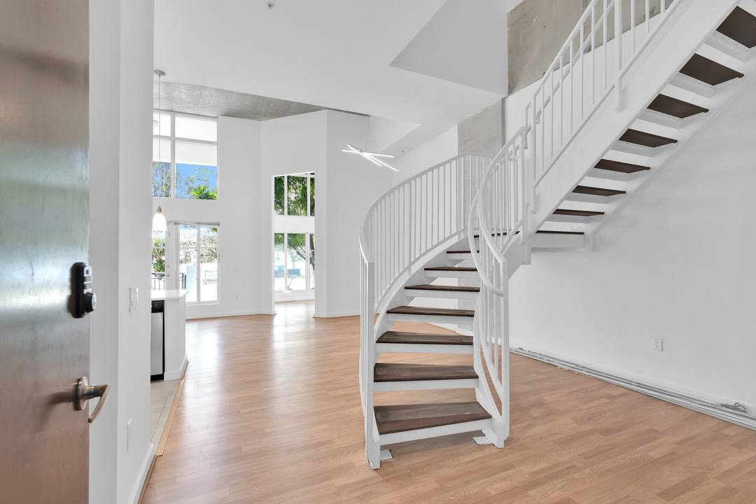 Desirable amp ; spacious 2 story townhome with dramatic 16 20 ft ceilings.