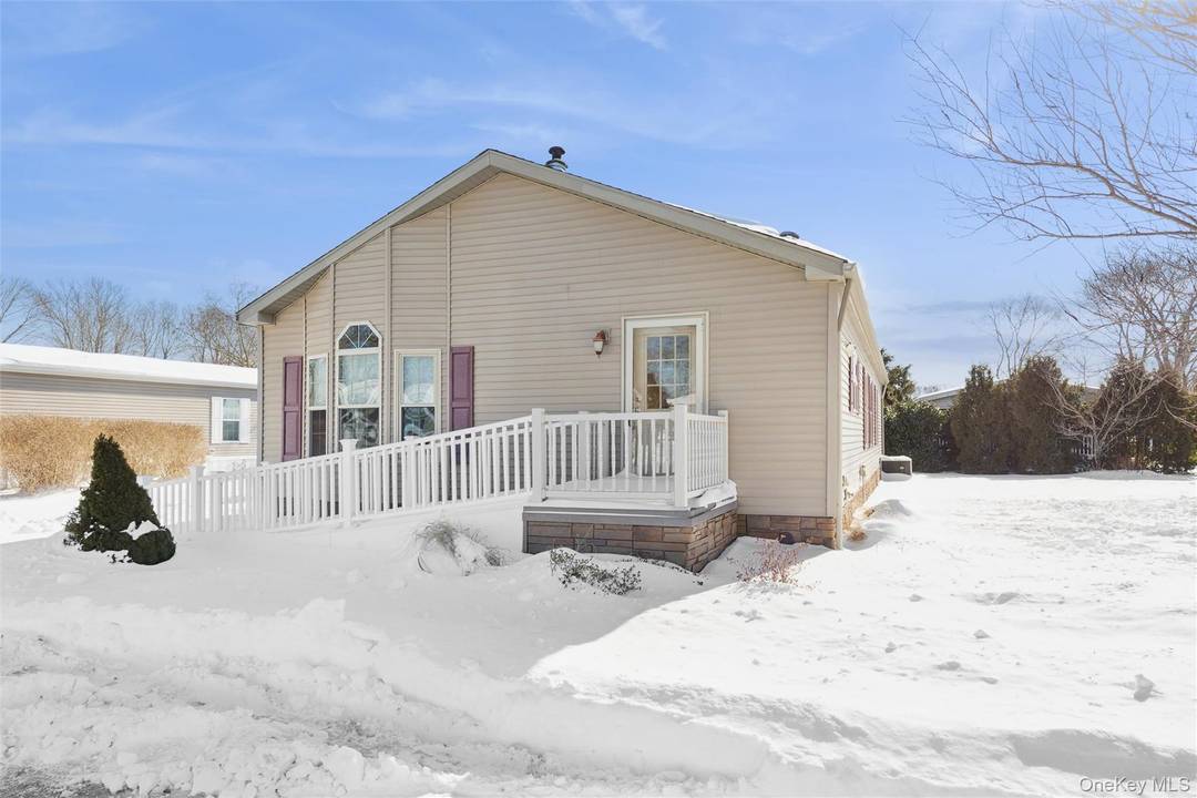 Beautifully maintained 3 bedroom, 2 bath home in a desirable 55 community in the heart of Riverhead.