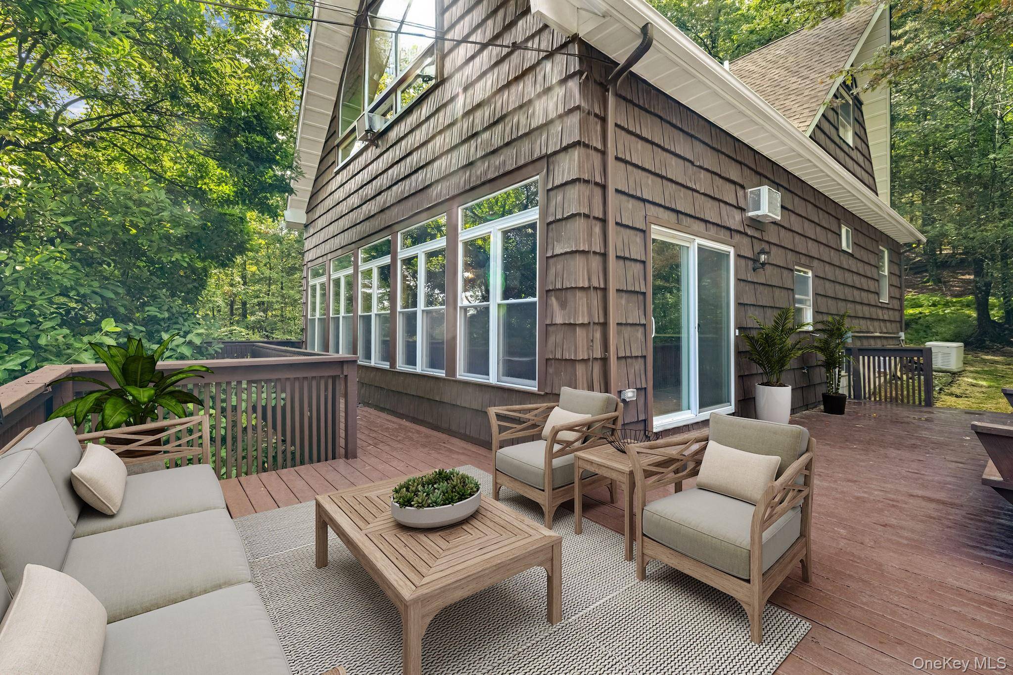 Nestled on a serene hillside, this lovely four story contemporary home offers a perfect balance of modern luxury and natural beauty.