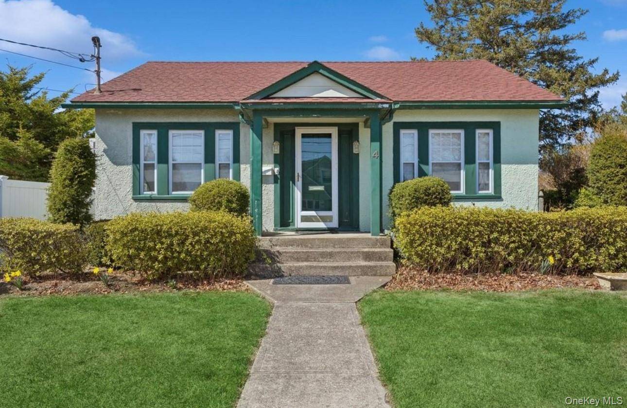 Charming ranch style home in the heart of Hicksville offering spacious living with a private yard.
