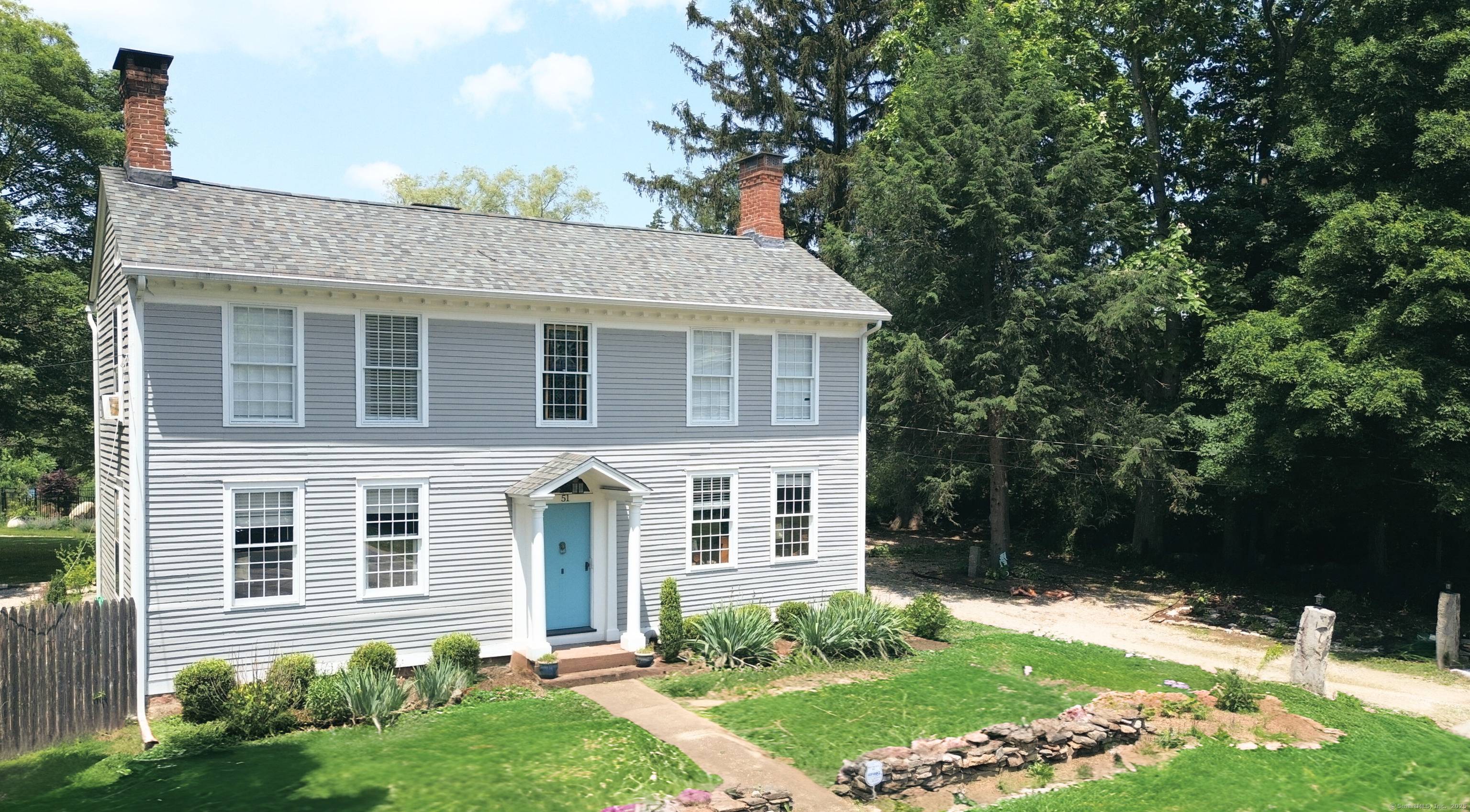 This federal Historic home is set amidst iconic new England stone walls, manicured lawns, mature pines, and charming perennials gardens.