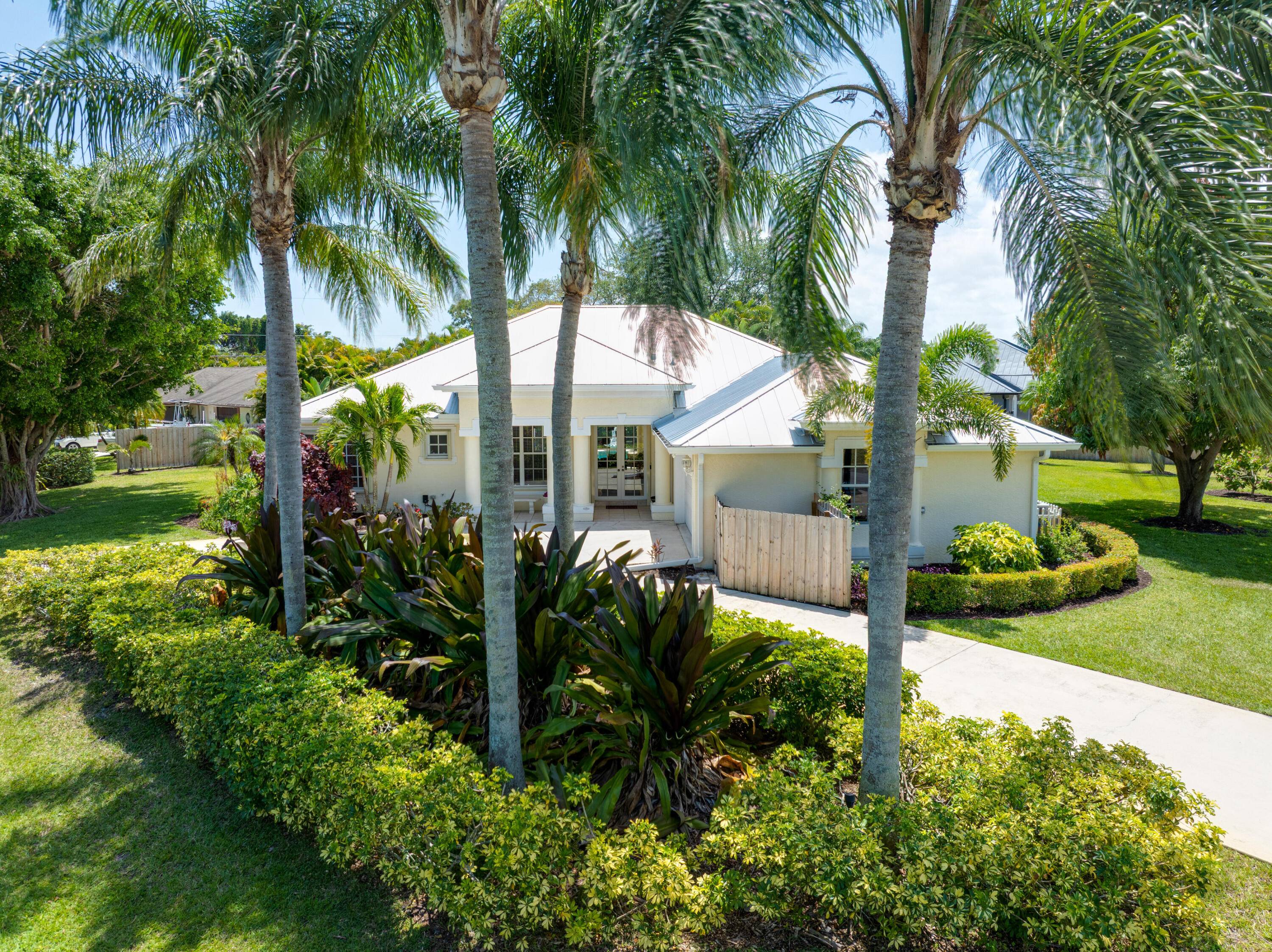 This custom built CBS pool home sits on a beautifully landscaped half acre corner lot with a circular driveway.