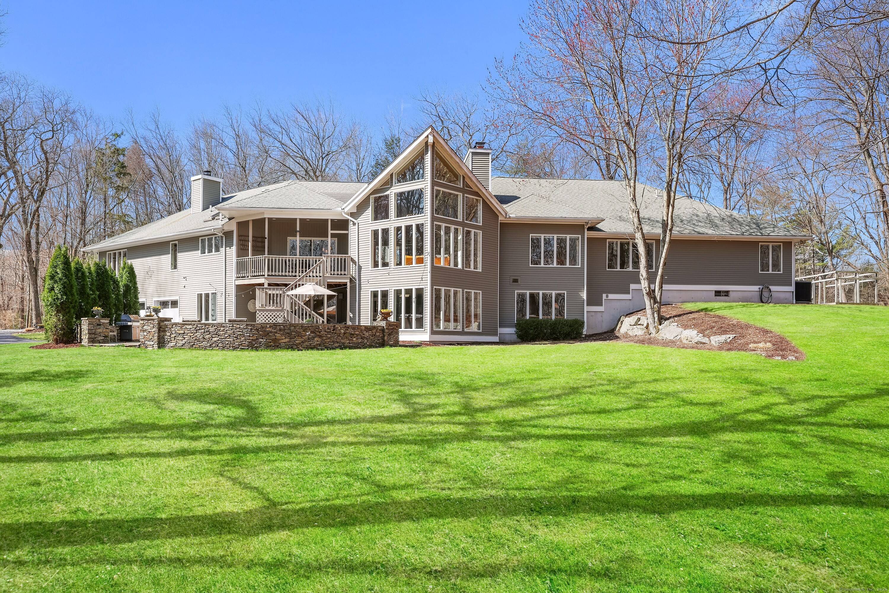 Just 60 miles east of New York City, on a quiet scenic country road in lower Easton's coveted Aspetuck Four Corners, nestled on 3 acres, is what appears to be ...