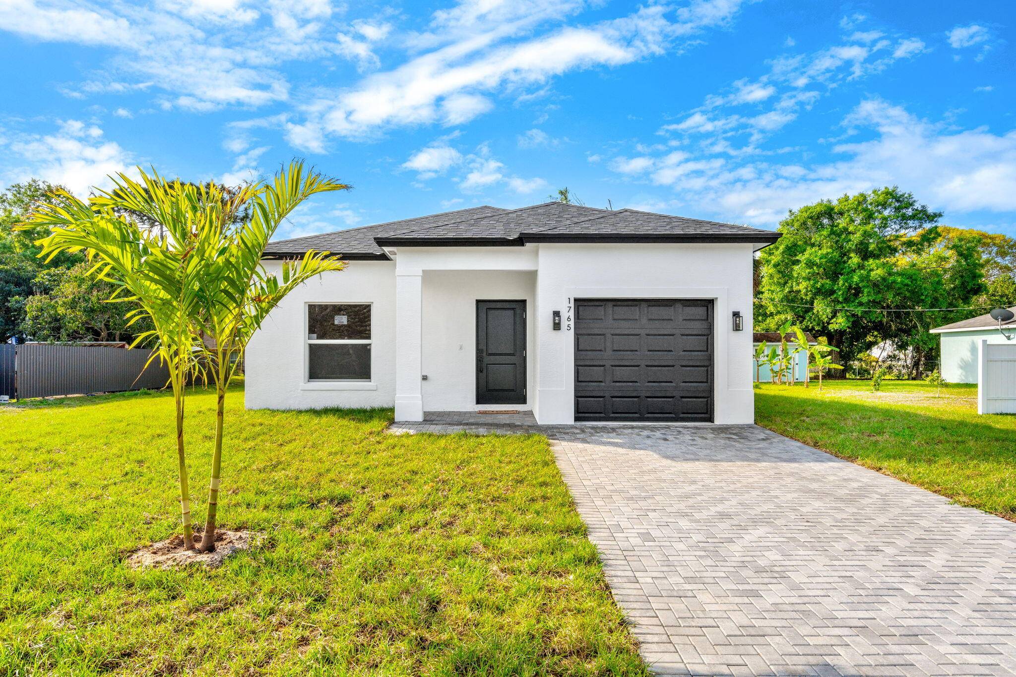 NEW CONSTRUCTION with beautiful high end finishes and impact windows and sliders throughout.
