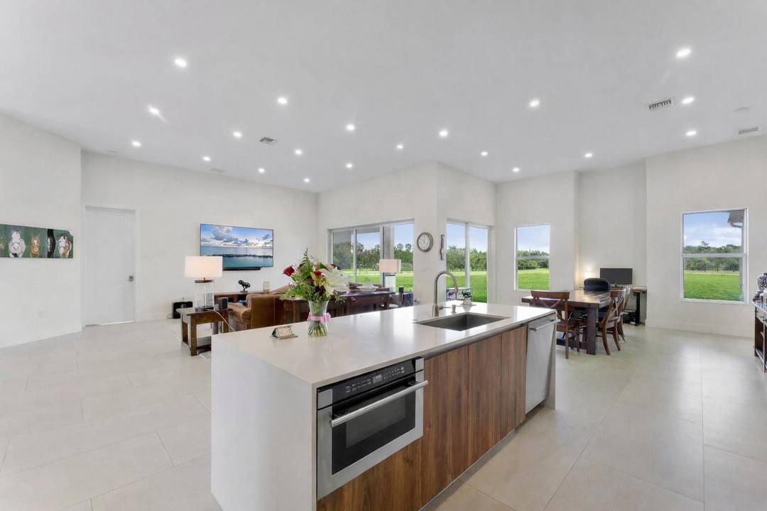 NEW CONSTRUCTION equestrian retreat set on cleared, elevated land, backing to a protected bird sanctuary with a private entrance to miles of horse trails.