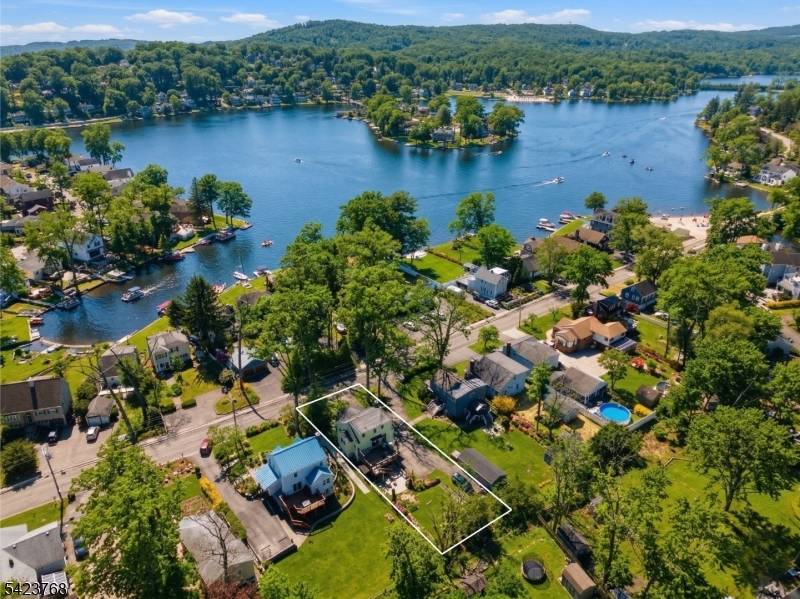 Charming 3 bdrm, 2 full bath Cape lake home in Denville's sought after Indian Lake community, blending timeless character with thoughtful updates.