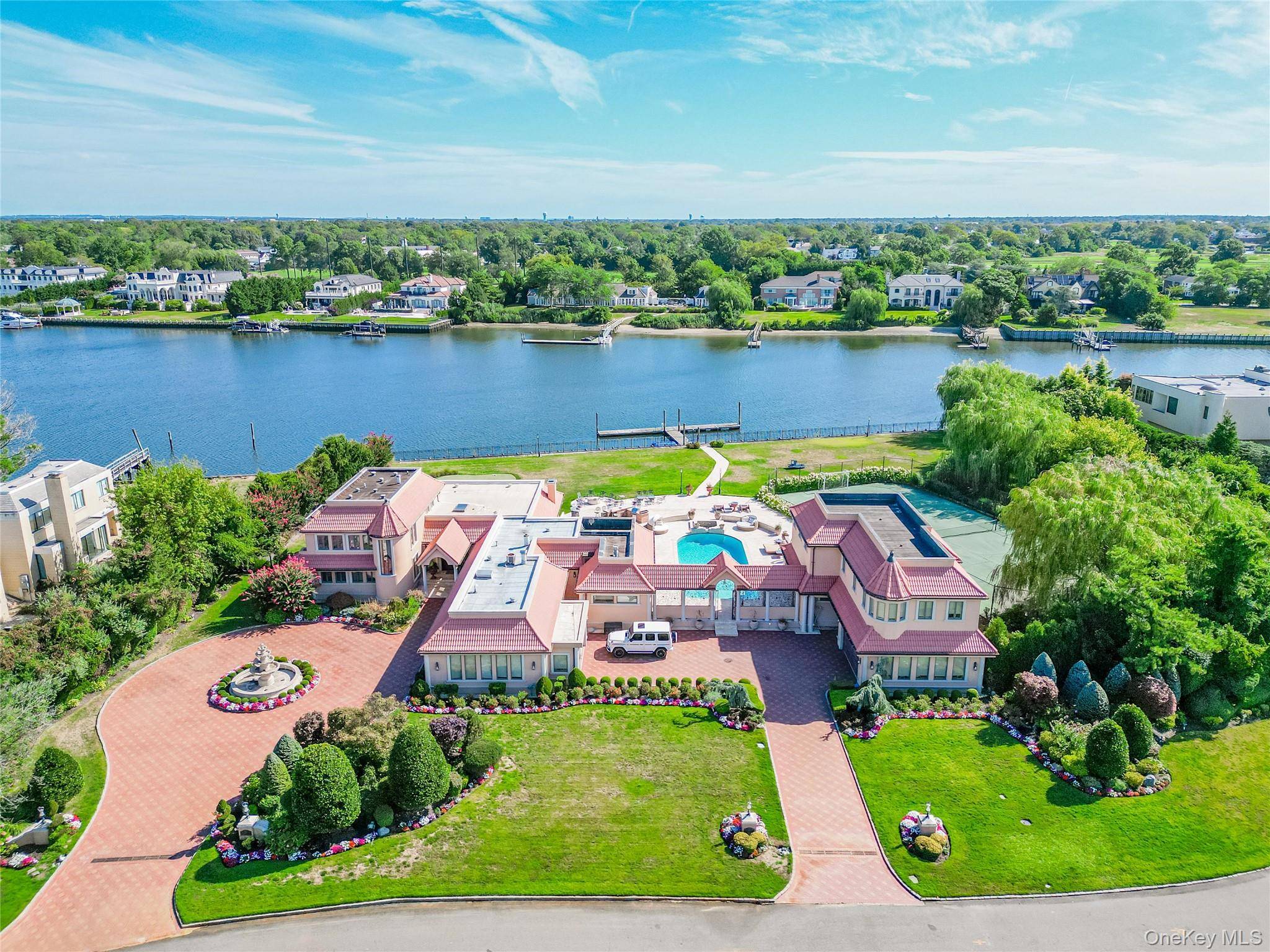 Discover one of the most magnificent waterfront estates in Hewlett Bay Park that redefines luxury living, perfectly nestled on over 2.