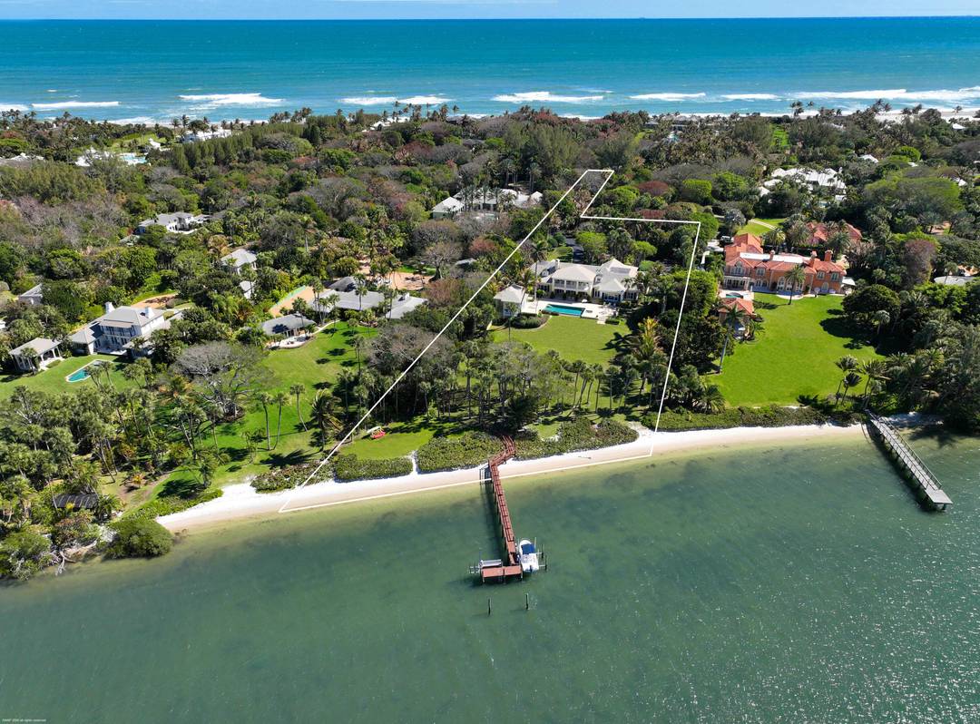 Welcome to 228 South Beach Road, a premier Intracoastal property on prestigious Jupiter Island.