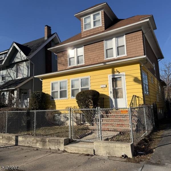 Charming Colonial with original wood trim, formal living and dining rooms, and abundant natural light.