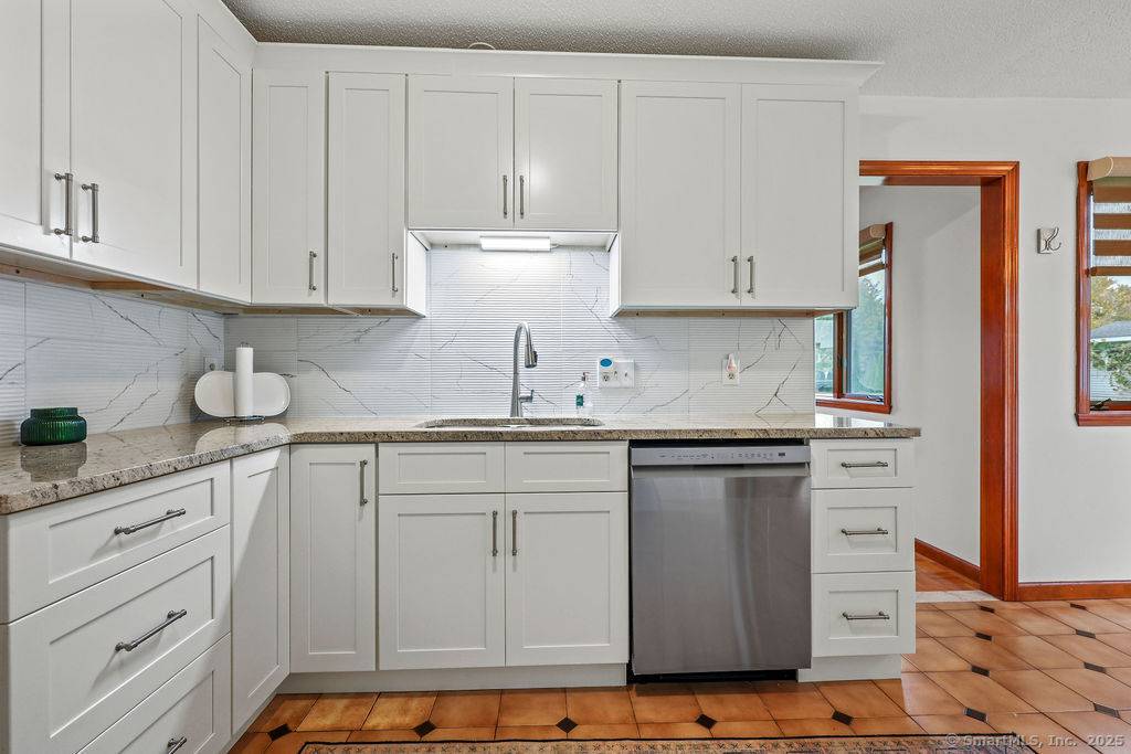 Welcome to 52 Sandy Drive, a spacious and beautifully maintained ranch in one of Rocky Hill's most desirable cul de sac neighborhoods.