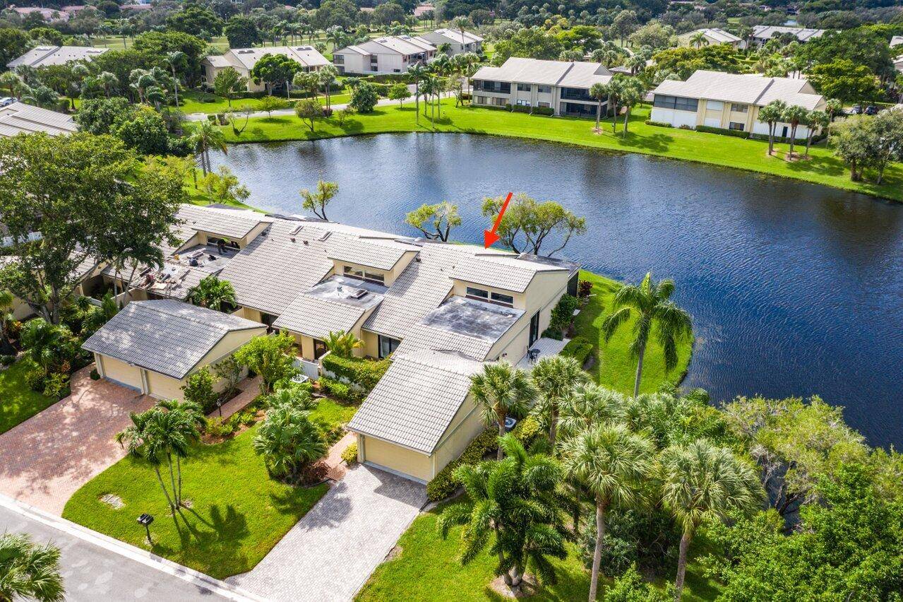 PRICED TO SELL ! Discover unparalleled privacy and panoramic water views from this bright and airy, impeccably maintained 2 bedroom corner villa in Eastgate at Hunters Run Country Club.