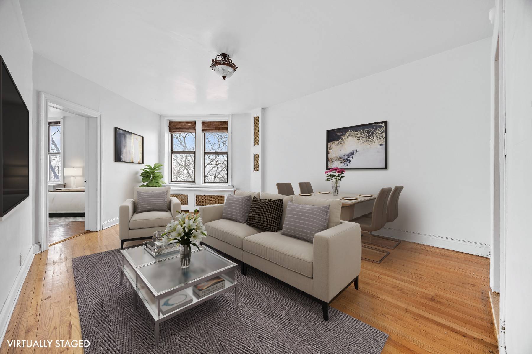 Experience the changing seasons from your sunlit one bedroom, one bathroom sanctuary, offering lush treetop vistas in summer and serene Hudson River views during fall and winter.