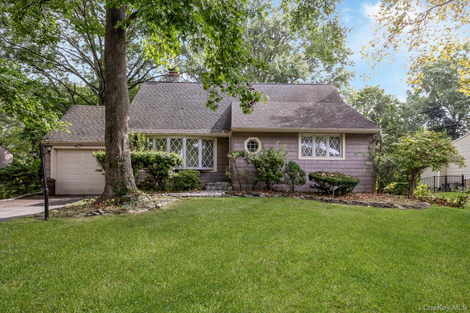 Welcome home to this charming one family home in the highly desirable Village of East Hills on a massive 90x125 lot !