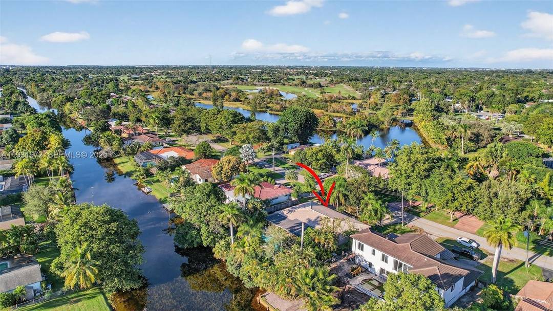 Located on W Tropical Way, one of Plantation s most prestigious streets, this waterfront home offers privacy and flexibility in a no HOA community.