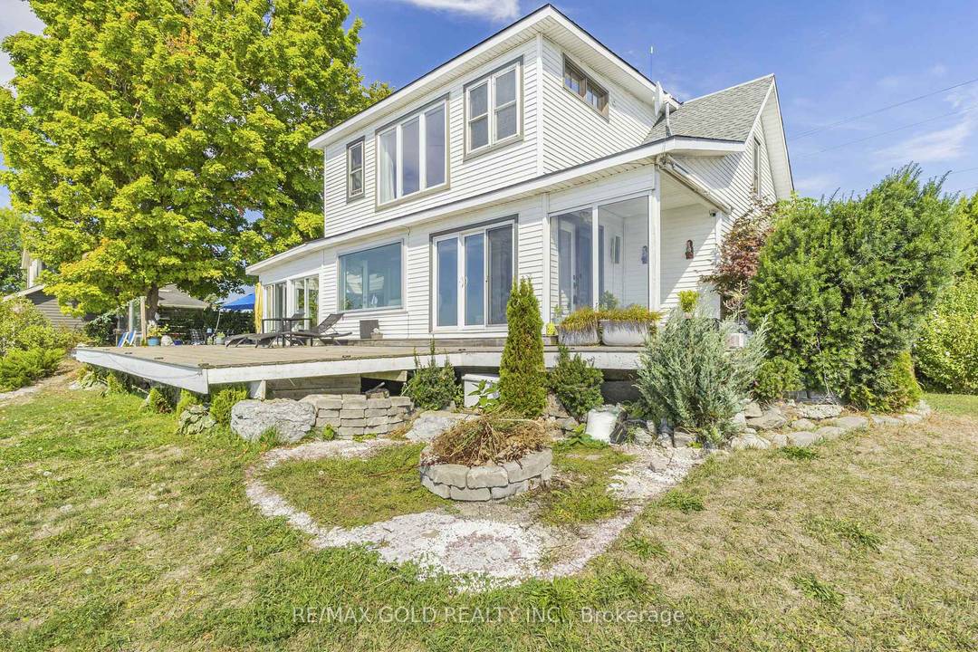 Enjoy lakeside living at its finest with this detached home on the shores of Lake Erie, offering breathtaking panoramic views and direct private access to a sandy beach.