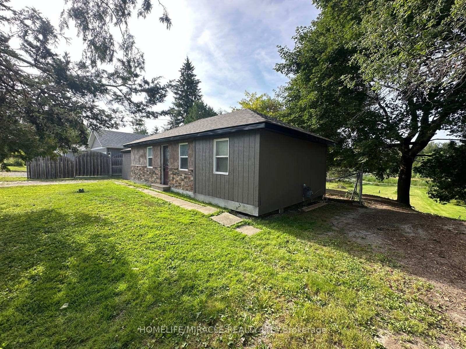 Discover this charming waterfront bungalow at 164 Riverbank Drive in Peffer law, offering a tranquil retreat on the Peffer law River with direct water access to the water and just ...