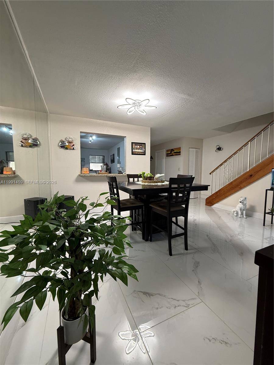 Beautiful and spacious 2 bedroom, 2 bathroom townhouse located in the heart of Doral, featuring a versatile extra room currently used as a third bedroom.