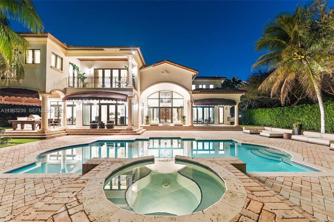 Mediterranean masterpiece on secluded Killian Park Rd in the heart of Pinecrest.