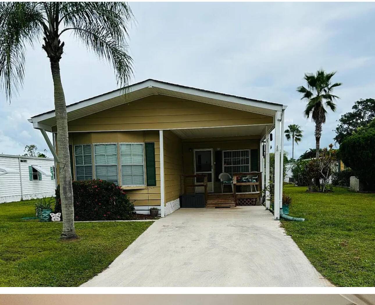 Step into this spacious mobile home located in Spanish Lakes Golf Village, an active over 55 community offering a wealth of amenities.