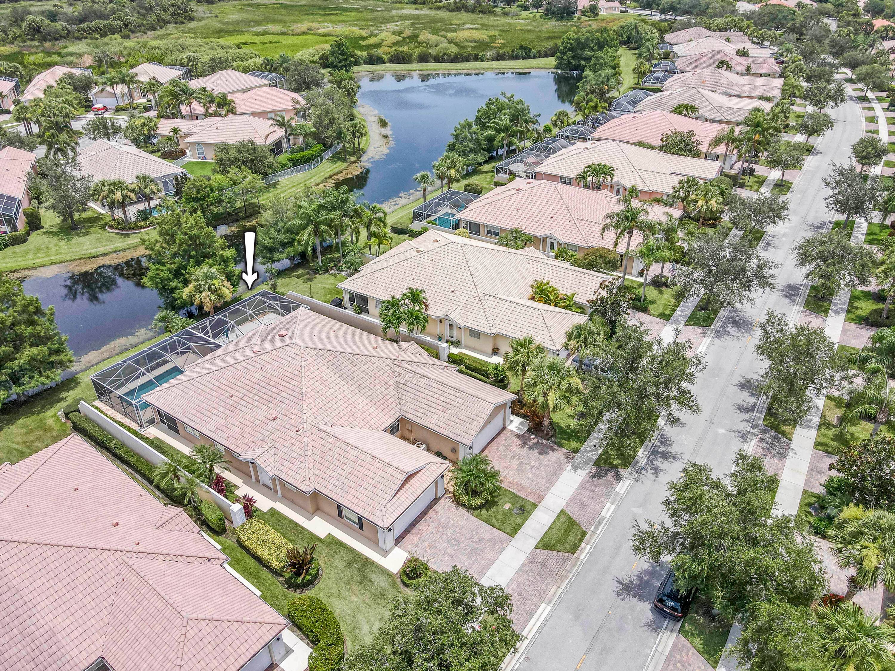 Meticulously maintained 2 2 lakefront villa in the desirable DiVosta built community, The Lakes at Tradition.