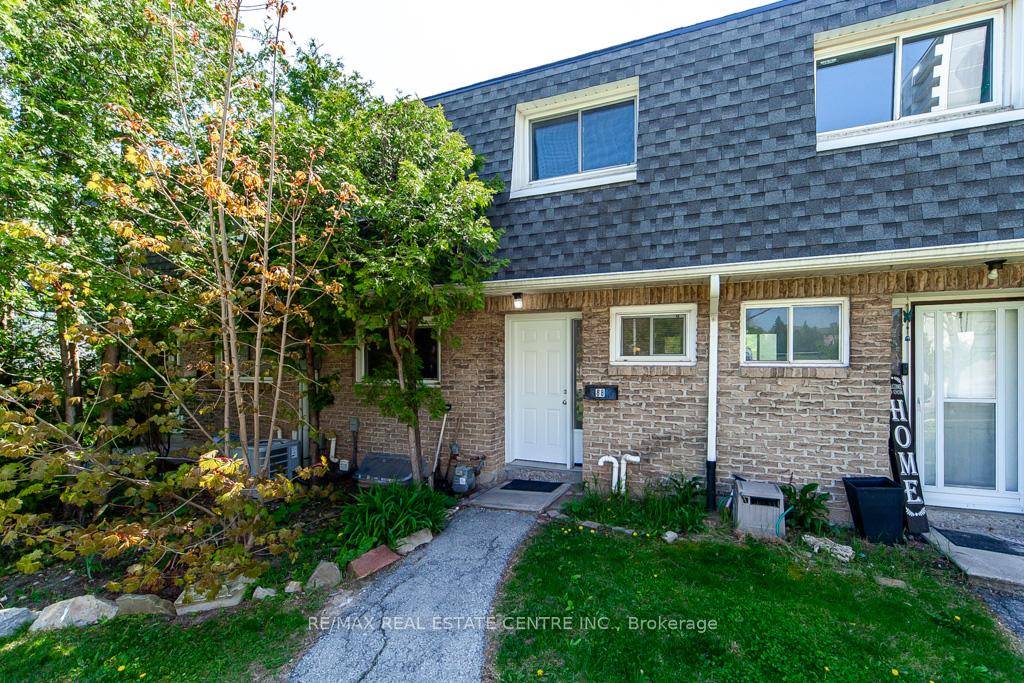 Welcome to this rare and uniquely located townhome, nestled within the tranquil and family friendly Brant Gardens complex.
