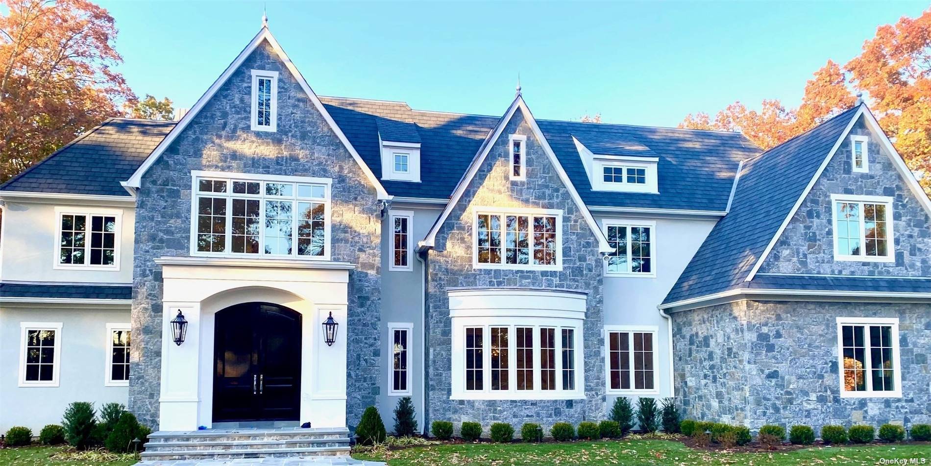 Experience the epitome of luxury living in the prestigious gated community of Stone Hill Muttontown.