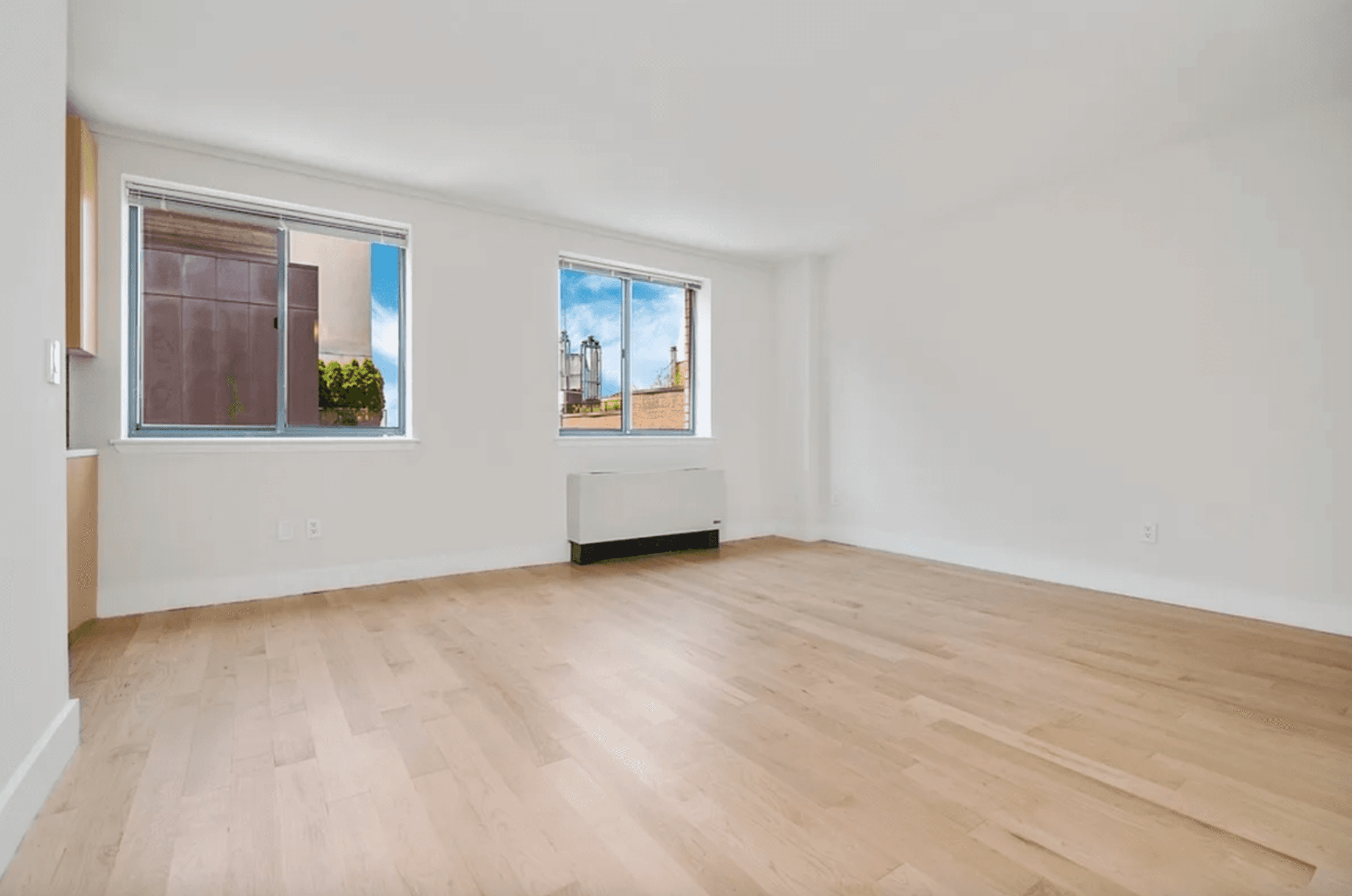 Gorgeous, Large West facing alcove studio with tons of windows and Sunny private garden Views on a quiet West Village street in a luxury building !