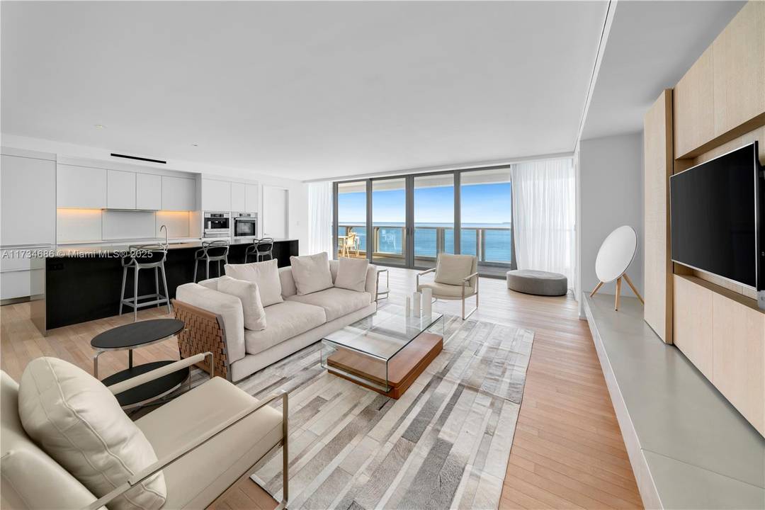 Experience unparalleled coastal living in this direct oceanfront home at The Edition Residences.