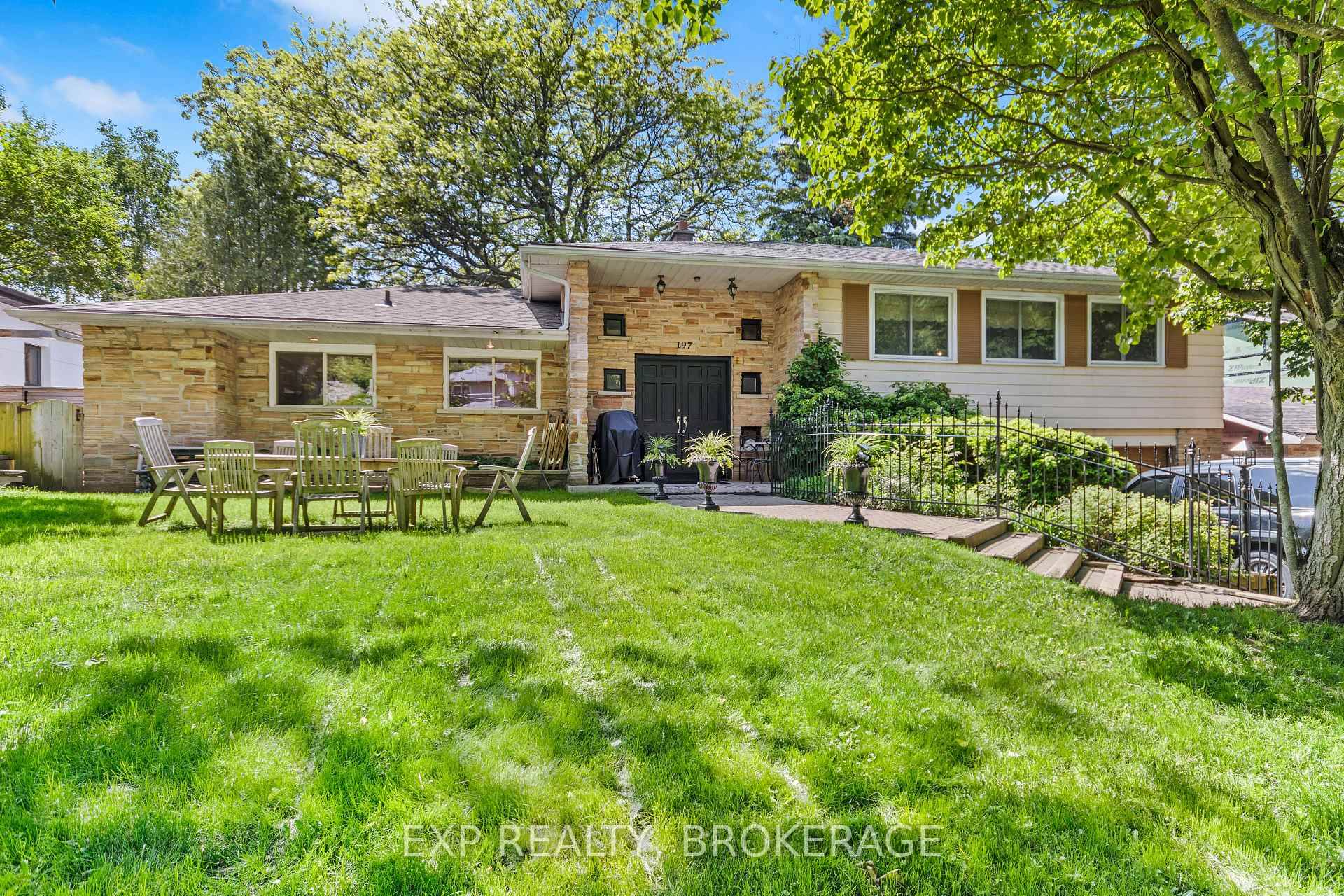 It is a gorgeous property with a well treed and landscaped lot overlooking the 13th tee of the Cataraqui Golf and Country Club.