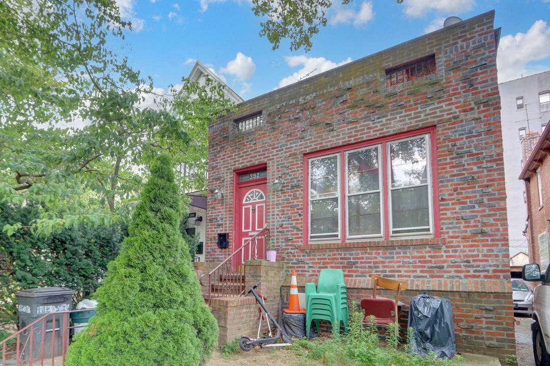 Colonial style home featuring five bedrooms, two full baths, a formal dining room, and a den.