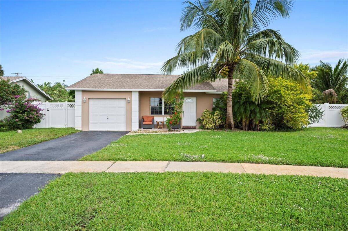This charming 3 bedroom, 2 bathroom single family home is located in the desirable West Boca area, offering the perfect blend of comfort and convenience.