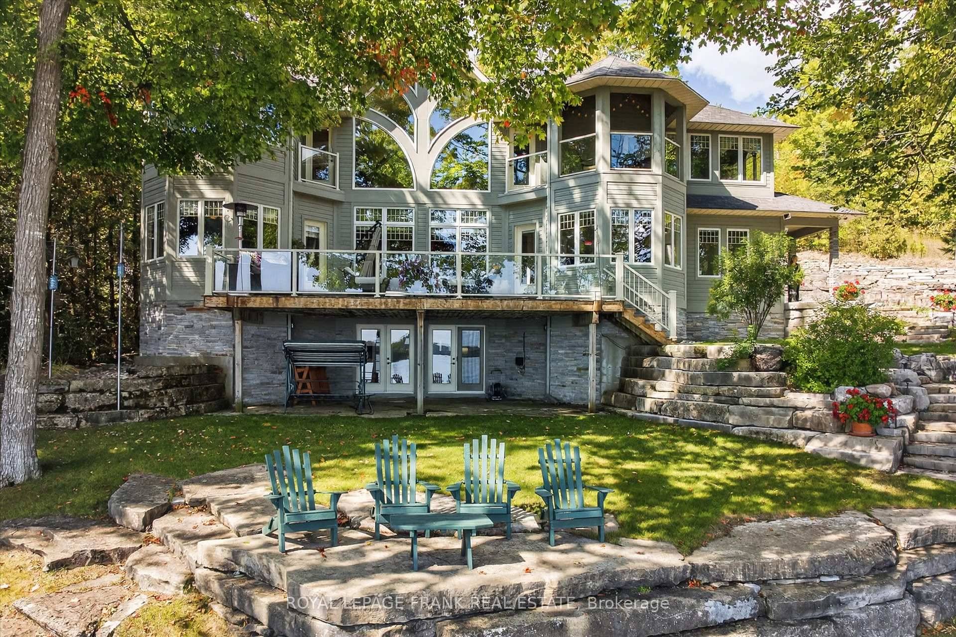 Welcome to 3081 Beachwood Dr, an exquisite custom built Arts amp ; Crafts Revival estate on the shores of Lower Buckhorn Lake.