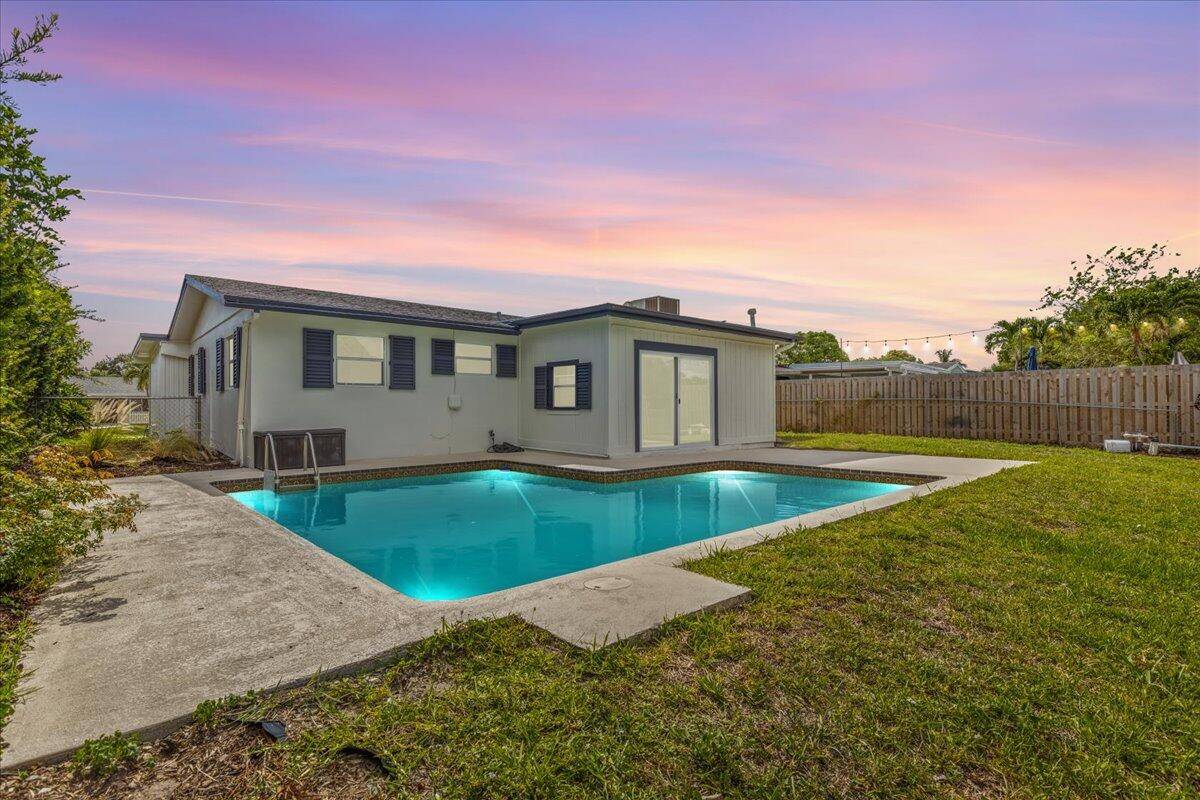 Welcome to this fully renovated 3 bedroom, 2 bathroom waterfront pool home in the heart of Palm Beach Gardens with no HOA.