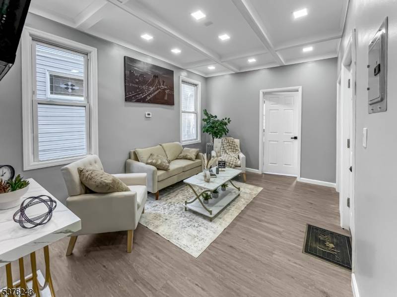 OPPORTUNITY AWAITS ! Ideal for both investors and owner occupants, this expansive two family home has been meticulously transformed with modern amenities and finishes.