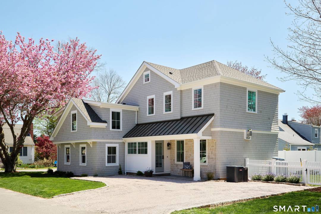 Completely rebuilt and expanded in 2026, this custom coastal home with deeded beach rights is located in Madison's charming Seafields Association.