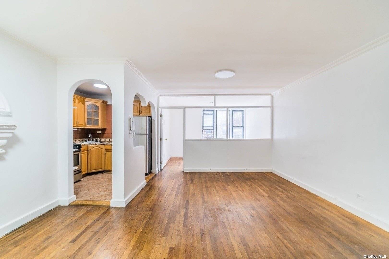 Welcome To This Spacious One Bedroom Apartment Located In The Center of Elmhurst.