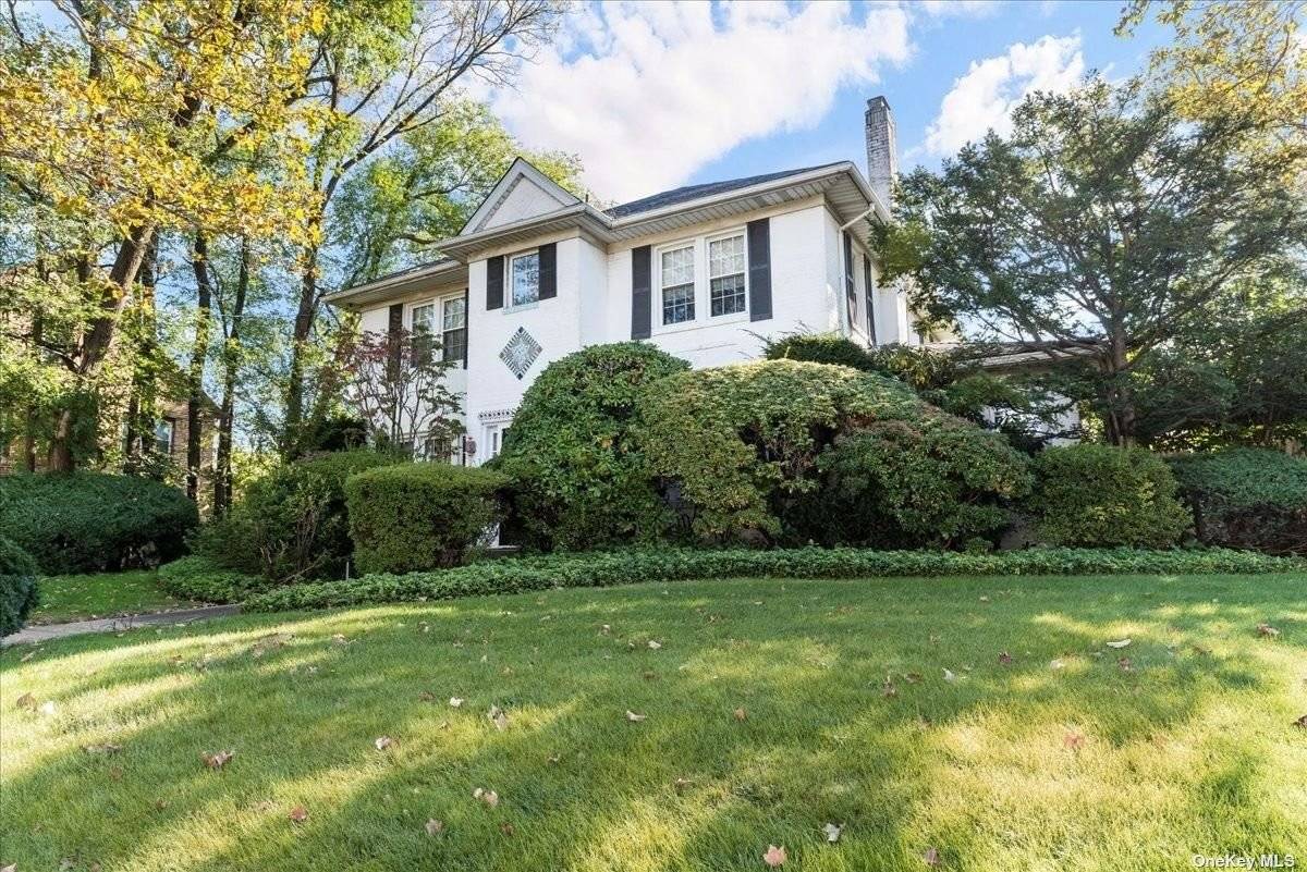 Stately center hall colonial in prime Woodmere location in school district 15.