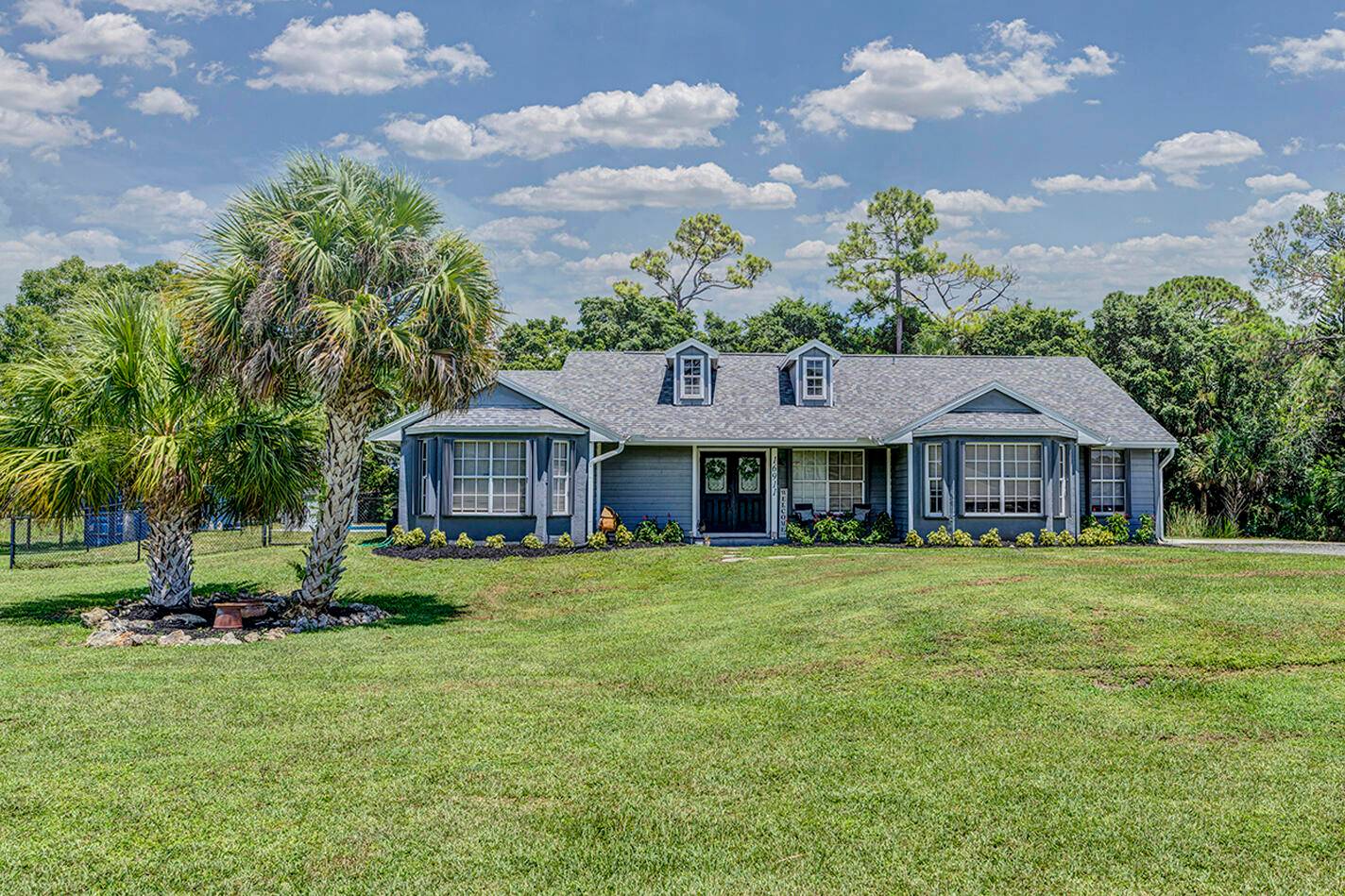 Welcome to this beautifully maintained 3 bedroom, plus bonus room, 2 bathroom home in Loxahatchee with NO HOA !