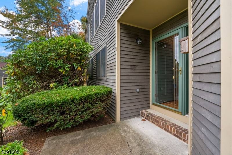 Beautifully updated and privately positioned, this end unit townhome in sought after Bald Eagle Village offers the ideal blend of light, space, and low maintenance living.
