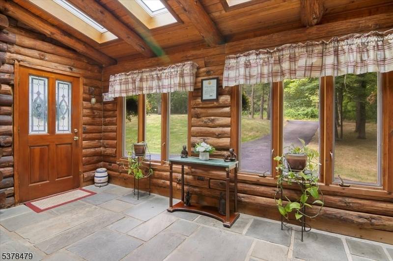 Experience the unique opportunity to own this well maintained log home, perfectly set on 2.